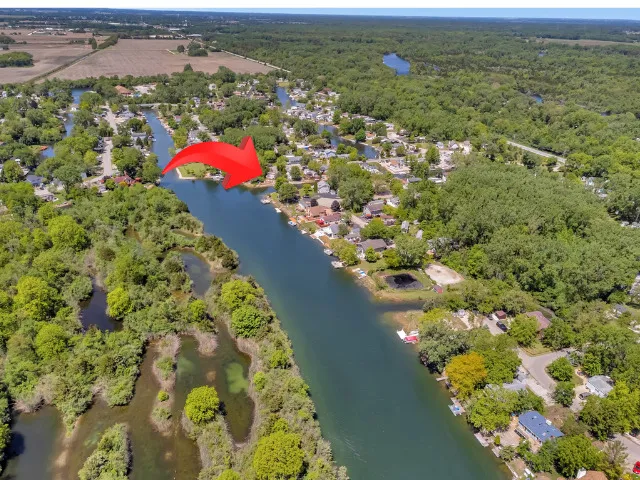 a view of a lake with a yard