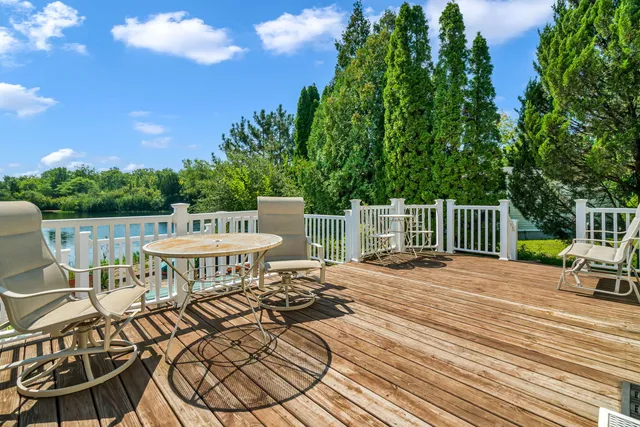a view of a chairs and table in the patio