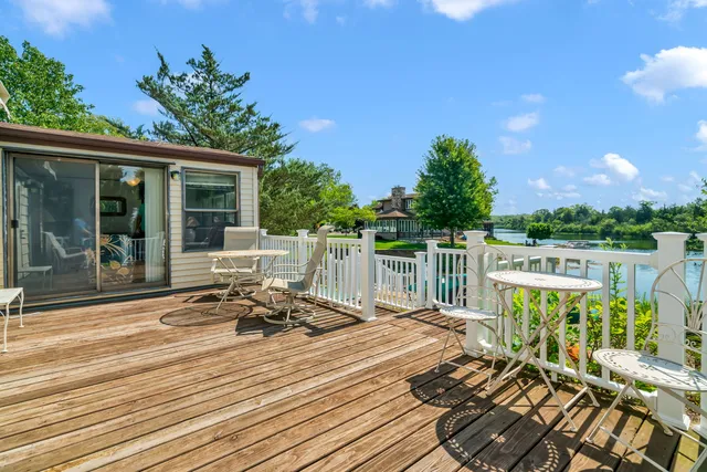 a view of a chair and tables on the roof deck