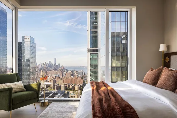 a kitchen with stainless steel appliances a stove microwave and sink