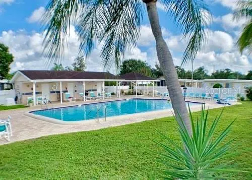 a view of a swimming pool with a patio