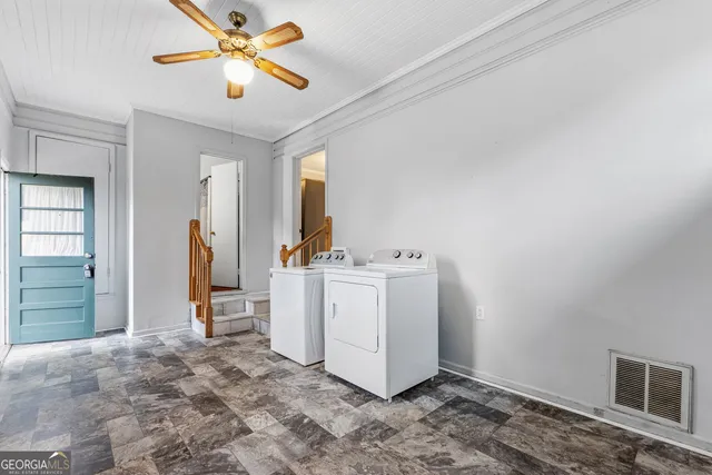 a view of a hallway with staircase