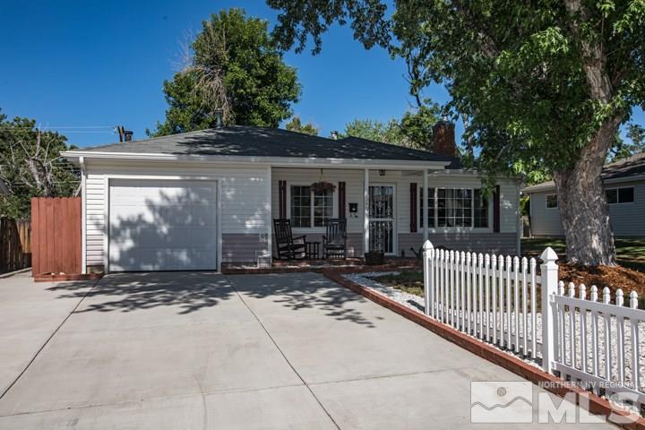 1345 Princess Avenue Reno, NV 89502 - Photo 1 of 23 a view of a house with a small yard and a large tree
