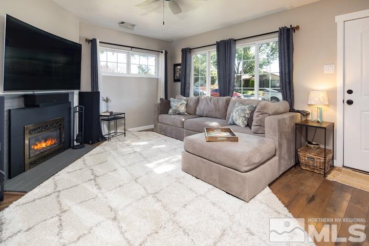 1345 Princess Avenue Reno, NV 89502 - Photo 12 of 23 a living room with furniture a flat screen tv and a fireplace