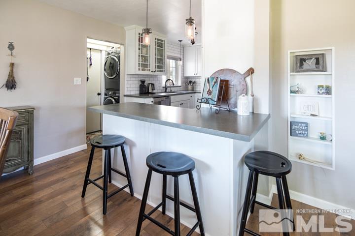 1345 Princess Avenue Reno, NV 89502 - Photo 13 of 23 a kitchen with stainless steel appliances a table and chairs in it