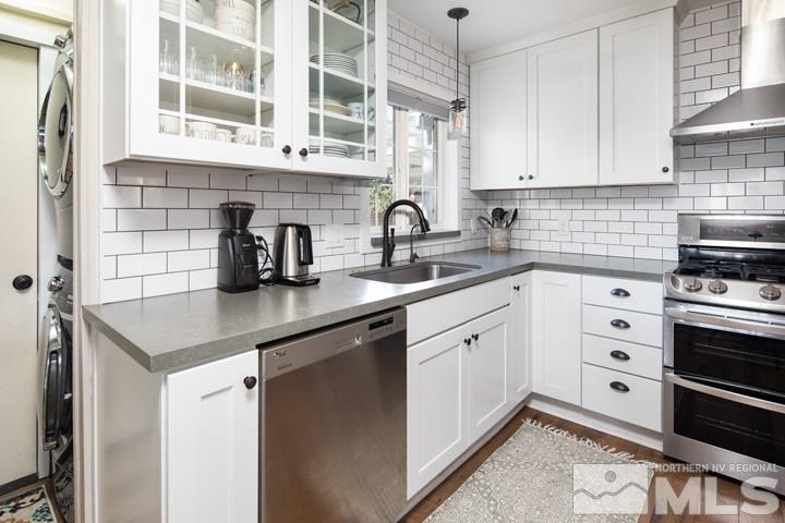 1345 Princess Avenue Reno, NV 89502 - Photo 15 of 23 a kitchen with stainless steel appliances a sink stove and cabinets