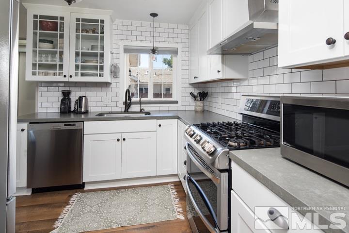 1345 Princess Avenue Reno, NV 89502 - Photo 16 of 23 a kitchen with granite countertop a sink stove and cabinets