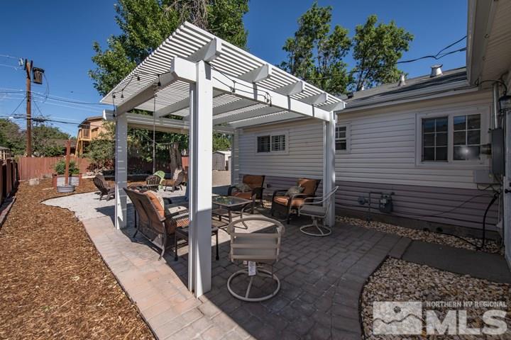 1345 Princess Avenue Reno, NV 89502 - Photo 17 of 23 a view of a patio with table and chairs and potted plants