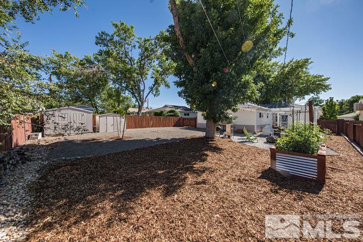 1345 Princess Avenue Reno, NV 89502 - Photo 22 of 23 a view of a yard with plants and trees