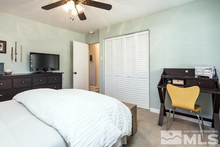 1345 Princess Avenue Reno, NV 89502 - Photo 6 of 23 a spacious bedroom with a bed and a flat screen tv