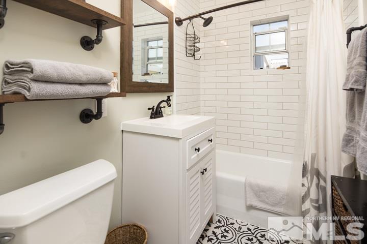 1345 Princess Avenue Reno, NV 89502 - Photo 8 of 23 a bathroom with a sink a toilet and shower