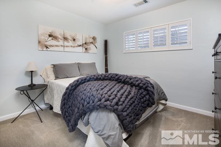 1345 Princess Avenue Reno, NV 89502 - Photo 9 of 23 a bedroom with a bed and painting on the wall