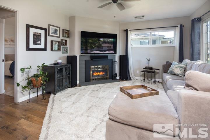 1345 Princess Avenue Reno, NV 89502 - Photo 10 of 23 a living room with furniture a flat screen tv and a fireplace