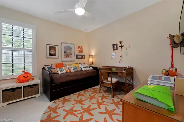 a bedroom with furniture and a chair