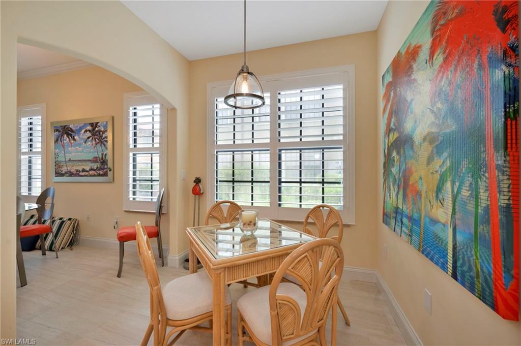 1299 Verde Drive, Unit 1503 Naples, FL 34105 - Photo 3 of 12 a dining room with furniture and window