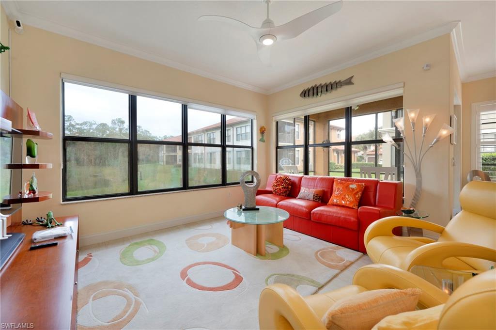 1299 Verde Drive, Unit 1503 Naples, FL 34105 - Photo 8 of 12 a living room with furniture and a large window