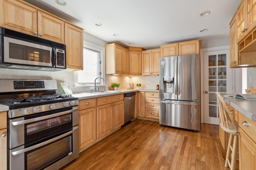 16 Meriam Street Wakefield, MA 01880 - Photo 14 of 42 a kitchen with a refrigerator stove and microwave