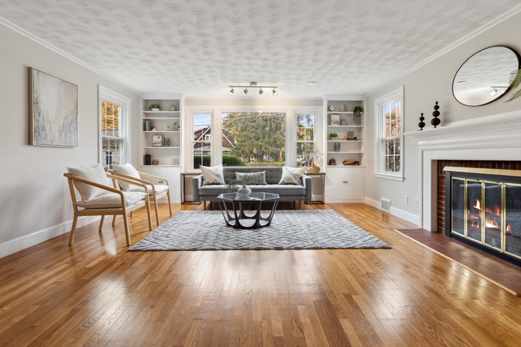 16 Meriam Street Wakefield, MA 01880 - Photo 2 of 42 a living room with furniture and a fireplace