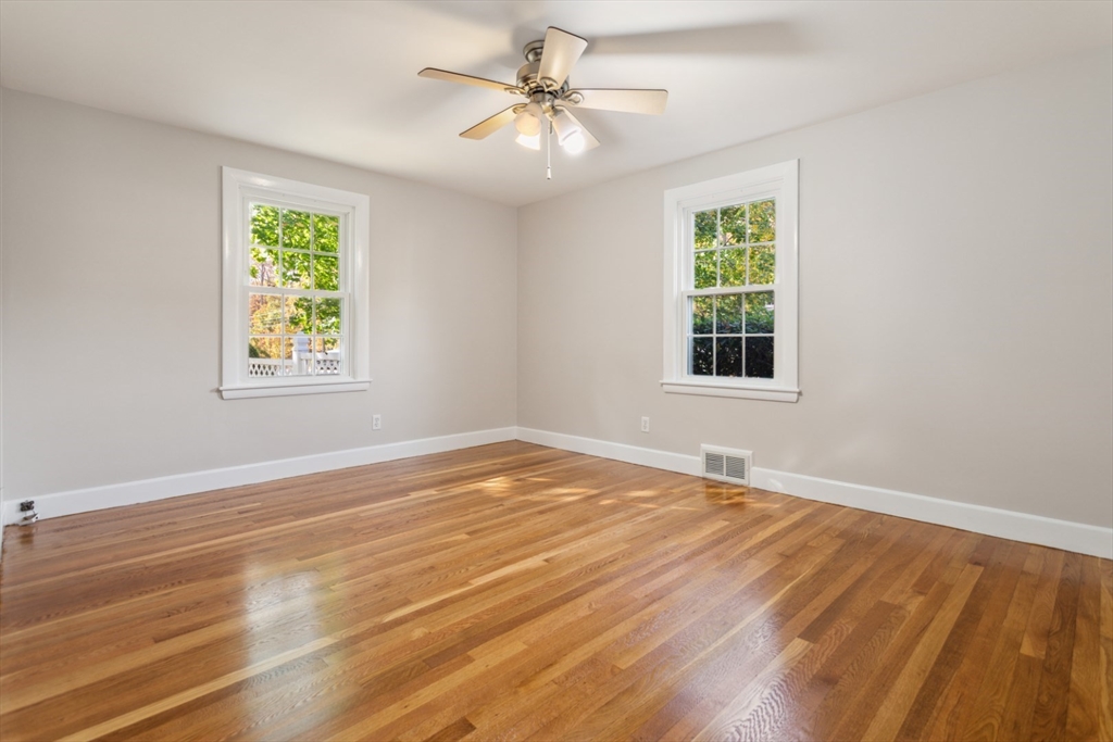 16 Meriam Street Wakefield, MA 01880 - Photo 22 of 42 a view of an empty room with window and wooden floor