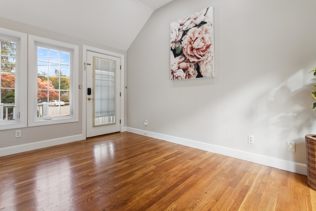 16 Meriam Street Wakefield, MA 01880 - Photo 23 of 42 an empty room with wooden floor and a window