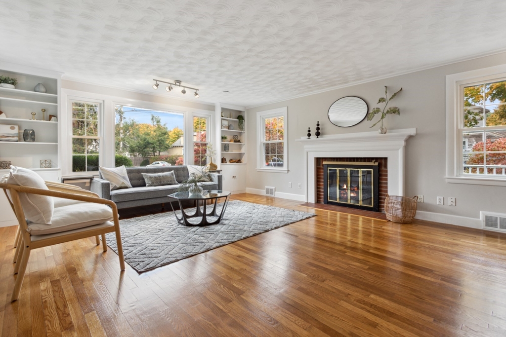 16 Meriam Street Wakefield, MA 01880 - Photo 3 of 42 a living room with furniture and a fireplace