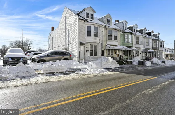 a front view of a building with street view