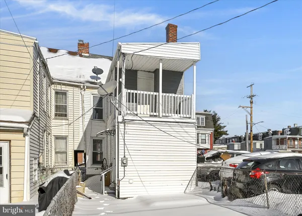 a view of a car park in front of house