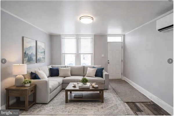 a living room with furniture and a window