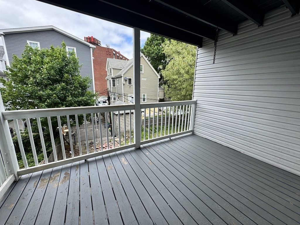 272 East Cottage Street, Unit 1 Boston, MA 02125 - Photo 6 of 10 a view of balcony with wooden floor