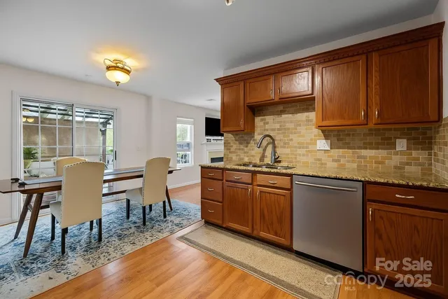 a bathroom with a granite countertop sink a toilet and a mirror