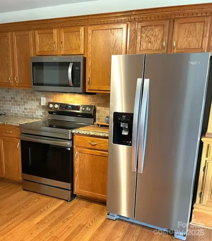 a view of a small space with wooden floor