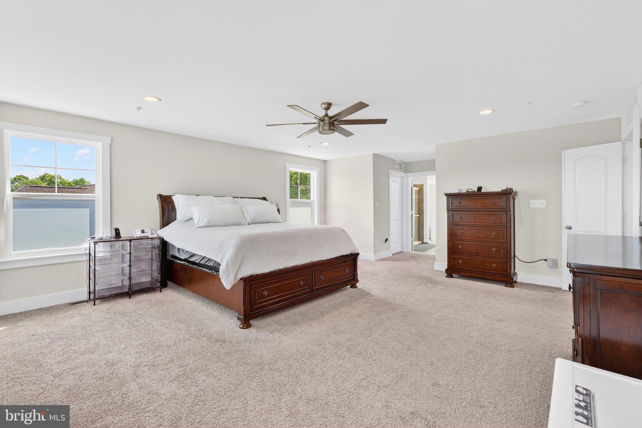30 Range Road North East, MD 21901 - Photo 37 of 73 a spacious bedroom with a bed and a ceiling fan