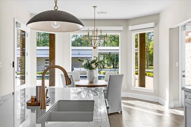 a view of a dining room with furniture window and outside view