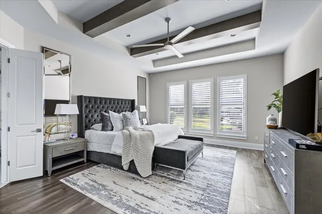 a bed room with a bed and a television