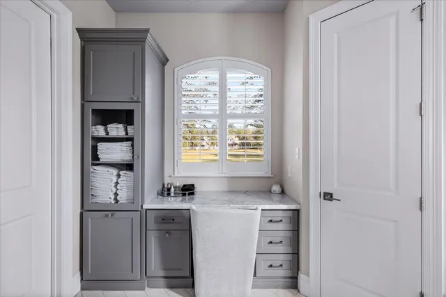 a kitchen with a refrigerator and window