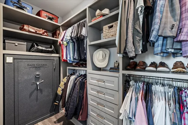 a view of a hallway with windows and stairs