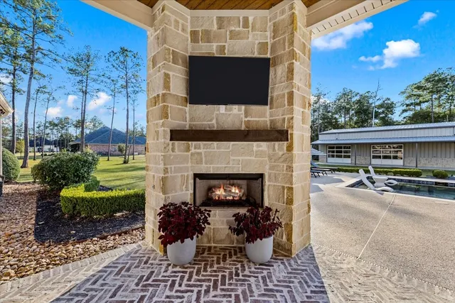 a view of house with swimming pool outdoor seating