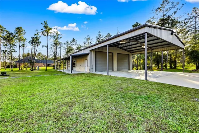 a view of a house with a yard and entertaining space