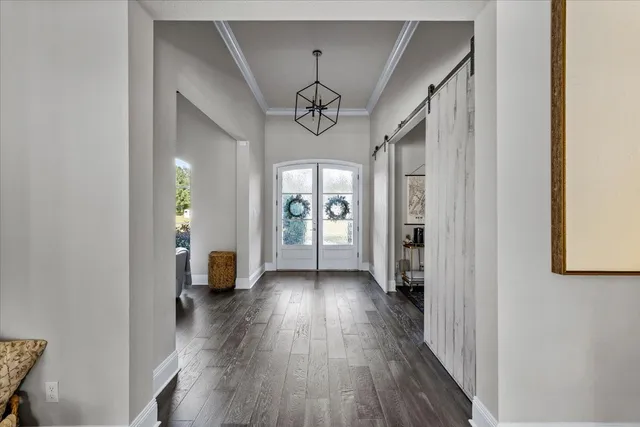 a view of an entryway with wooden floor