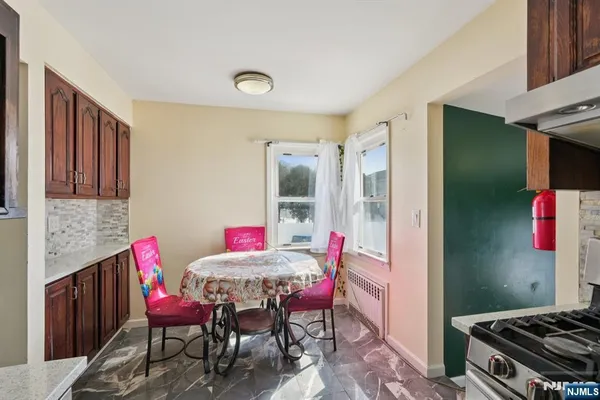 a outdoor dining space with furniture and wooden floor