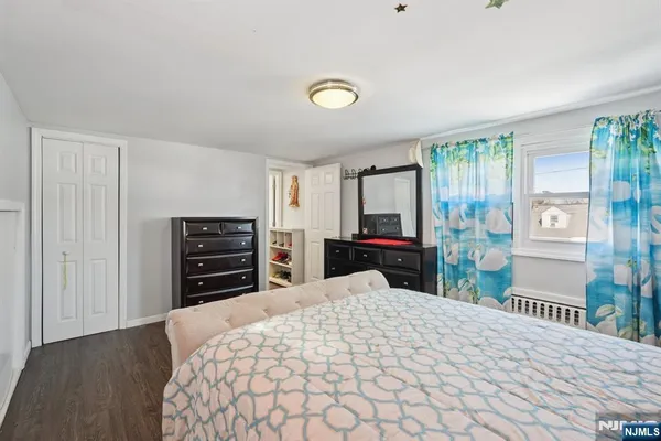 a large bedroom with furniture