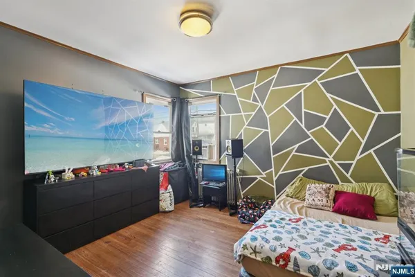 a bedroom with a bed and a dresser