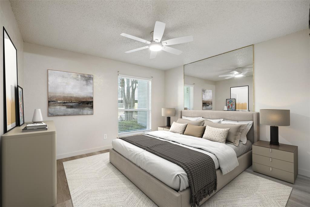 11480 Audelia Road, Unit 136 Dallas, TX 75243 - Photo 23 of 29 Neutral wall color with wood-finish flooring