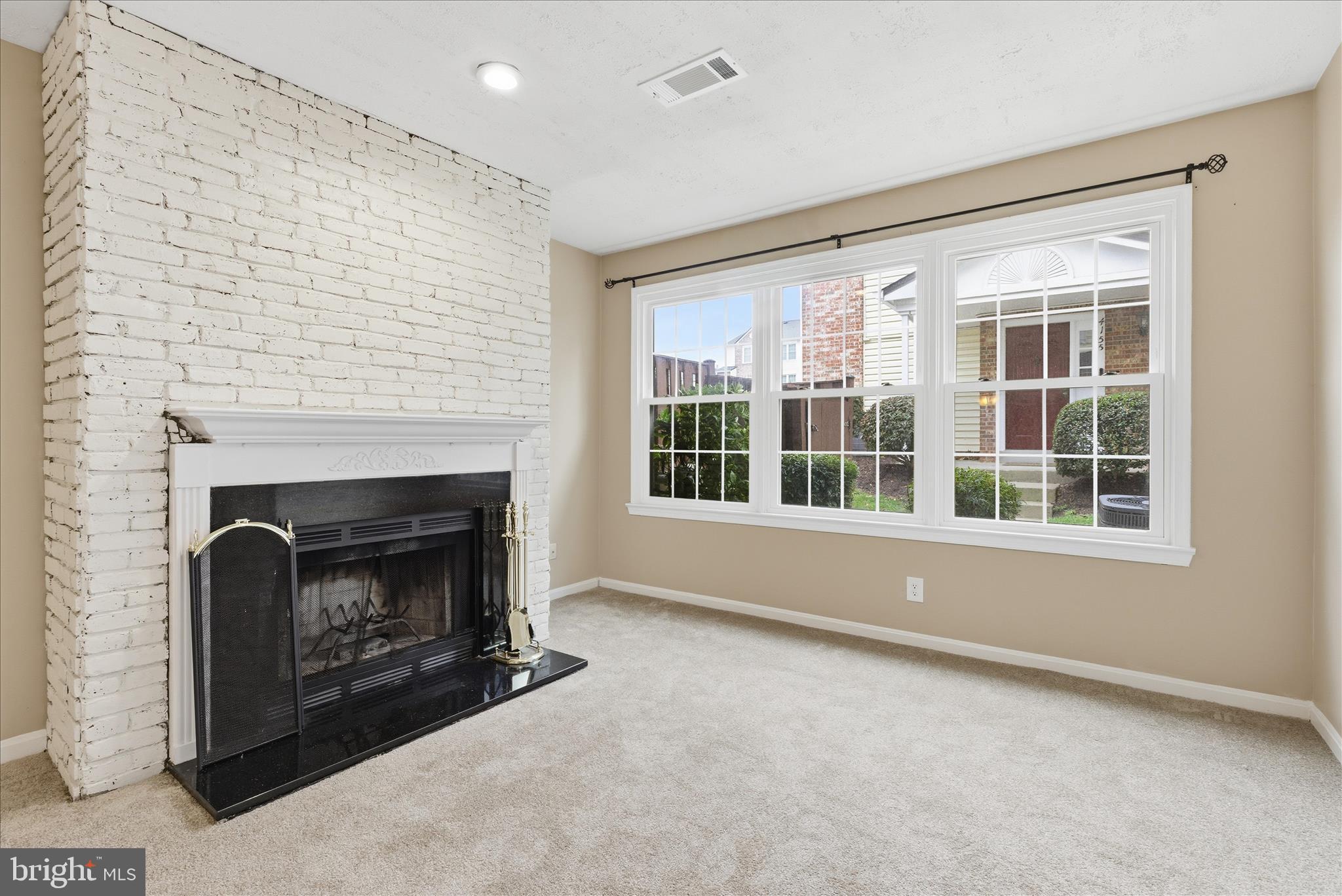 4167 Churchman Way Woodbridge, VA 22192 - Photo 12 of 36 a living room with furniture and a fireplace