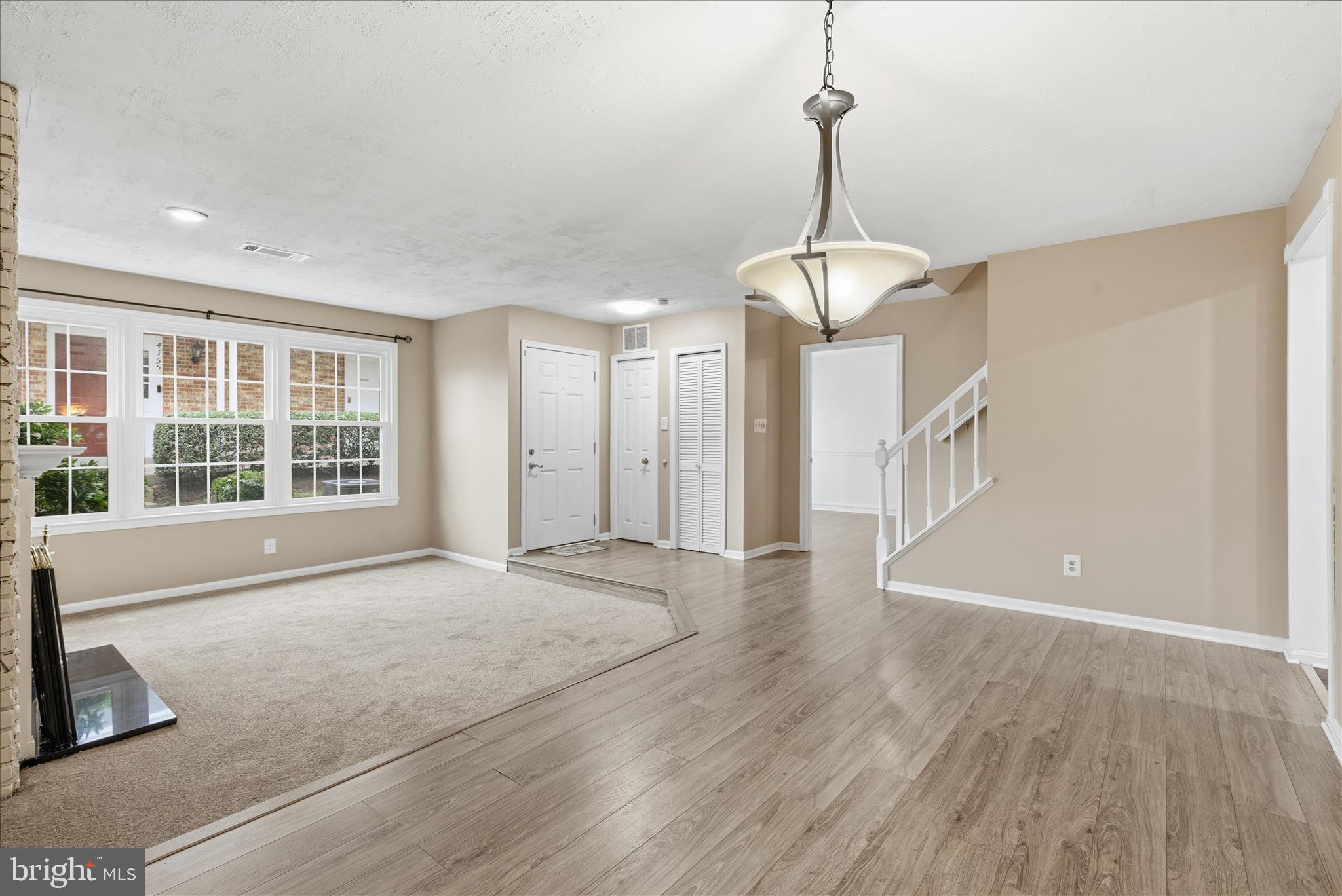 4167 Churchman Way Woodbridge, VA 22192 - Photo 14 of 36 a view of an empty room with wooden floor and a window