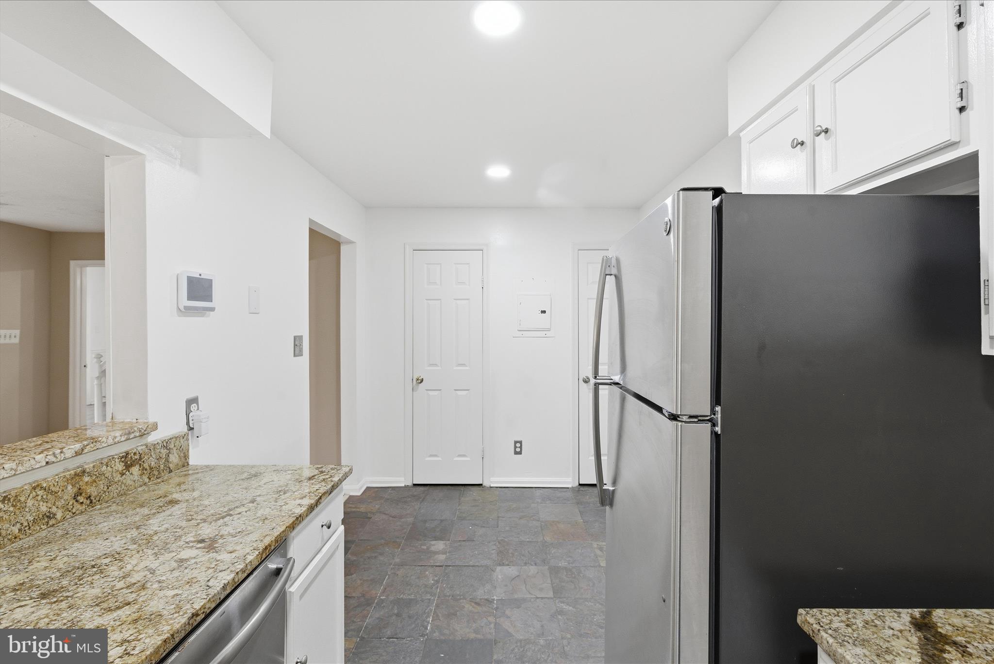 4167 Churchman Way Woodbridge, VA 22192 - Photo 18 of 36 a view of a kitchen with a sink and refrigerator