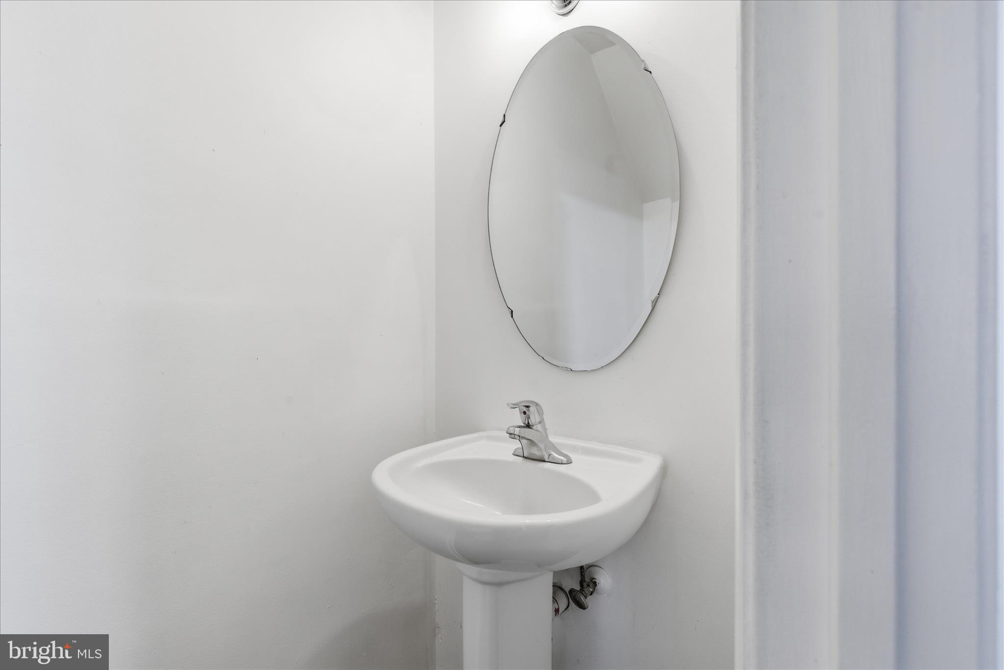 4167 Churchman Way Woodbridge, VA 22192 - Photo 19 of 36 a bathroom with a sink and a mirror