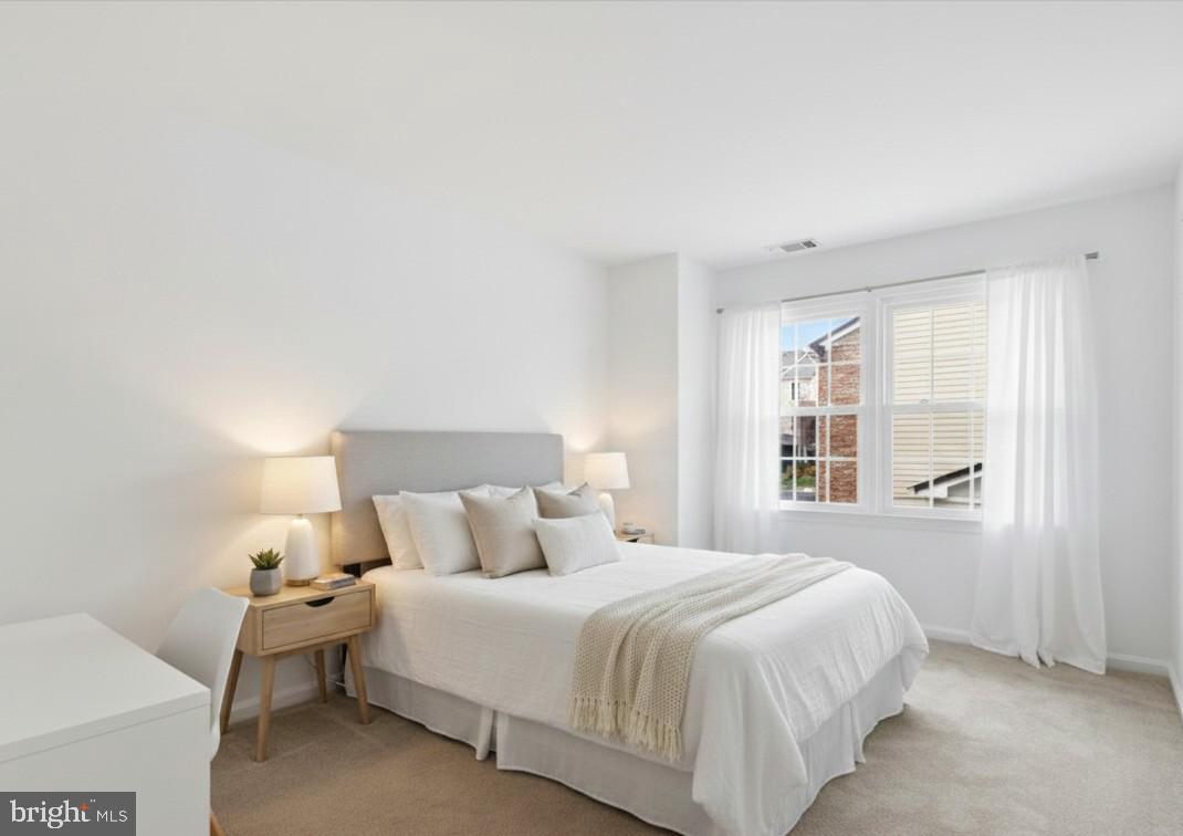 4167 Churchman Way Woodbridge, VA 22192 - Photo 22 of 36 a bedroom with a bed and a large window