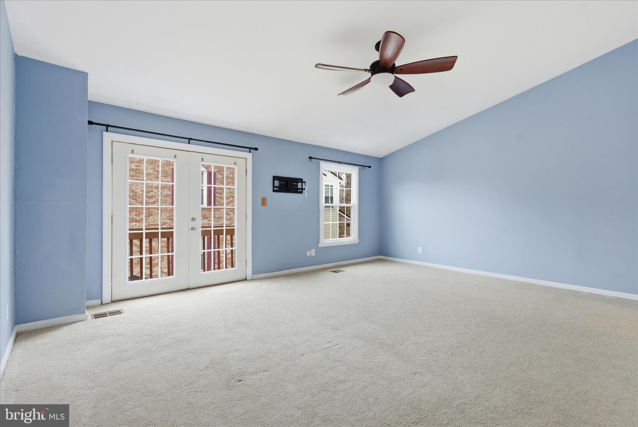 4167 Churchman Way Woodbridge, VA 22192 - Photo 28 of 36 a view of an empty room with a ceiling fan and window