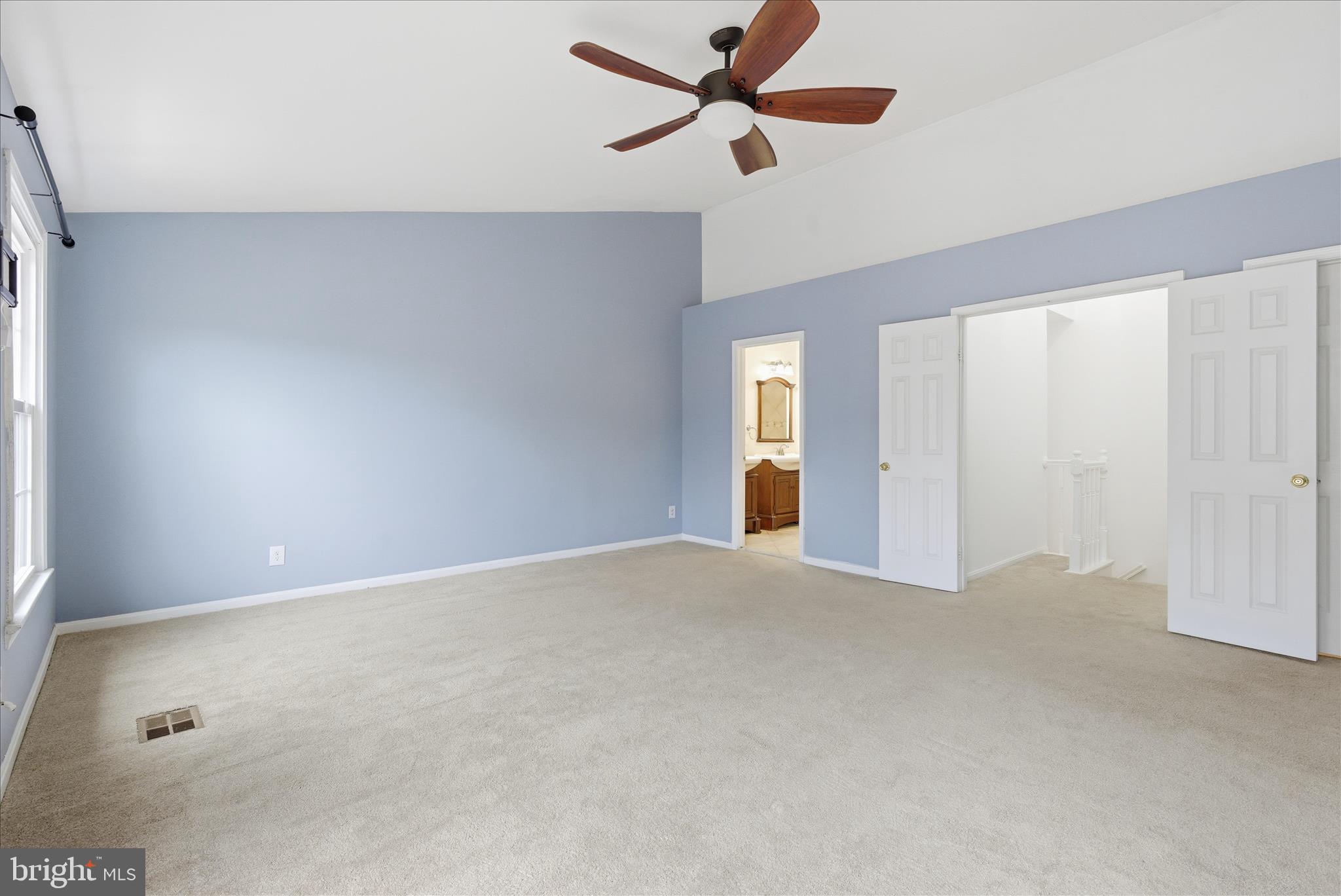 4167 Churchman Way Woodbridge, VA 22192 - Photo 30 of 36 a view of a livingroom with a ceiling fan and window